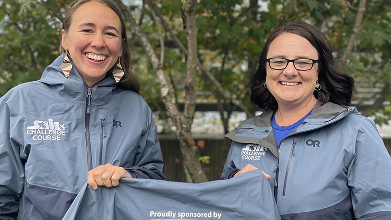 ORCA program employees holding up shirt with Hecla logo (Greens Creek news)