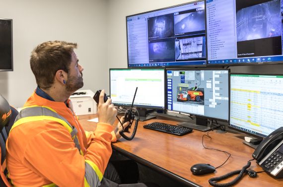 A miner working with a computer.