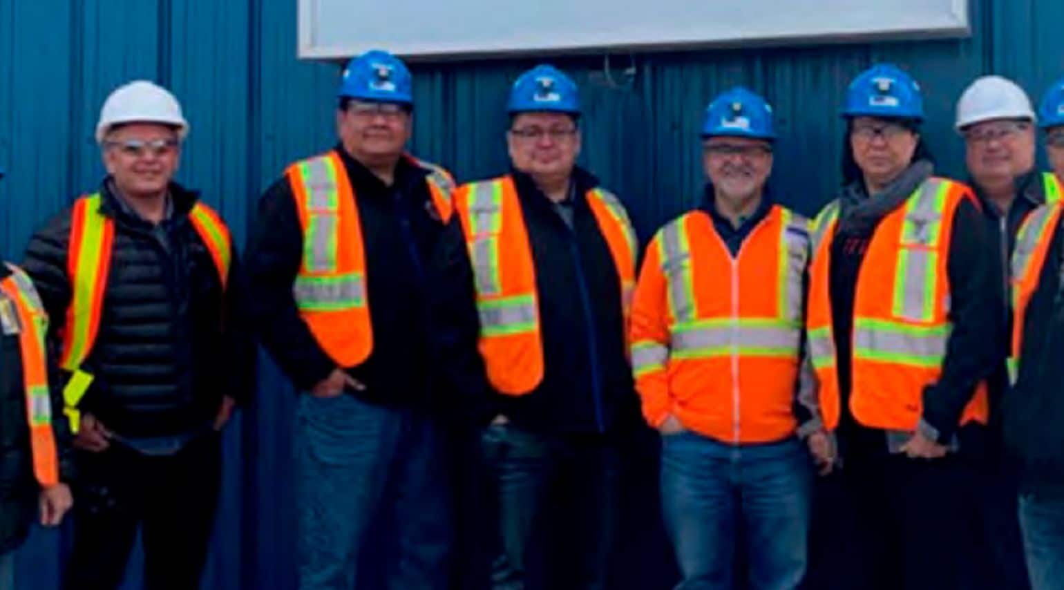 A group of miners smiling.