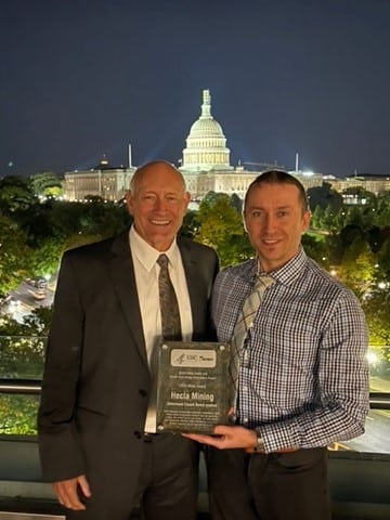 Two men holding the Niosh Award