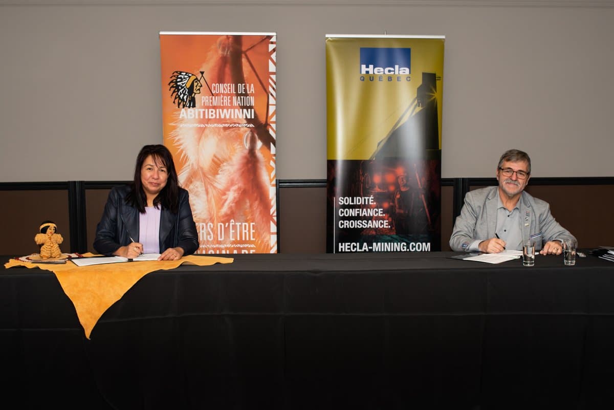 two people Signing the Cooperation Agreement